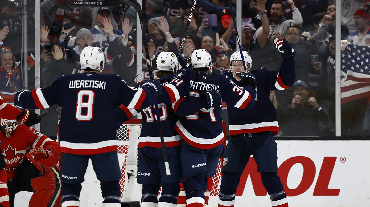 Team USA forward Brady Tkachuk (7) and forward Auston Matthews (34) celebrate defenseman Jake Sanderson (85) goal against Team Canada during the second period during the 4 Nations Face-Off ice hockey championship game at TD Garden