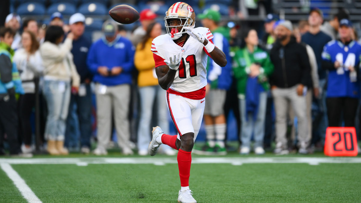 San Francisco 49ers wide receiver Brandon Aiyuk (11) catches the ball during warmups before the game against the Seattle Seahawks at Lumen Field.