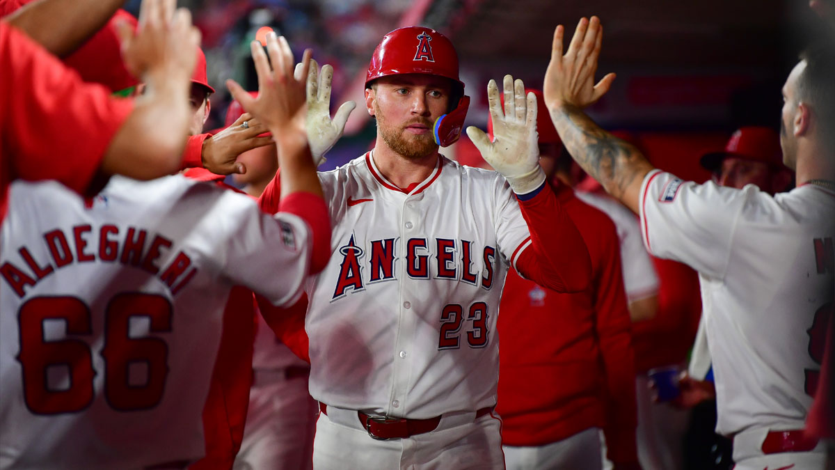 Los Angeles Angels second baseman Brandon Drury (23) is greeted after hitting a solo home run against the Seattle Mariners during the fifth inning at Angel Stadium.