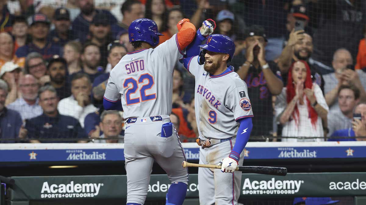 New York Mets right fielder Juan Soto (22) celebrates with left fielder Brandon Nimmo (9) after hitting a home run during the game against the Houston Astros at Daikin Park.