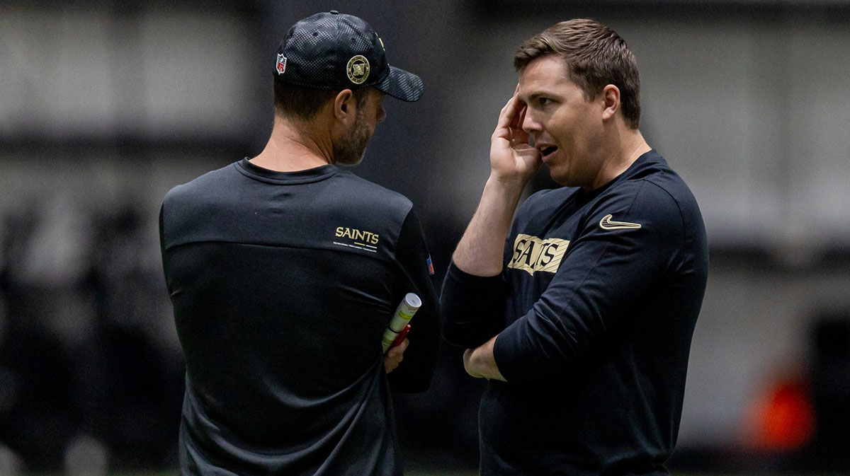 New Orleans Saints head coach Kellen Moore talks with defensive coordinator Brandon Staley during rookie minicamp at Ochsner Sports Performance Center.