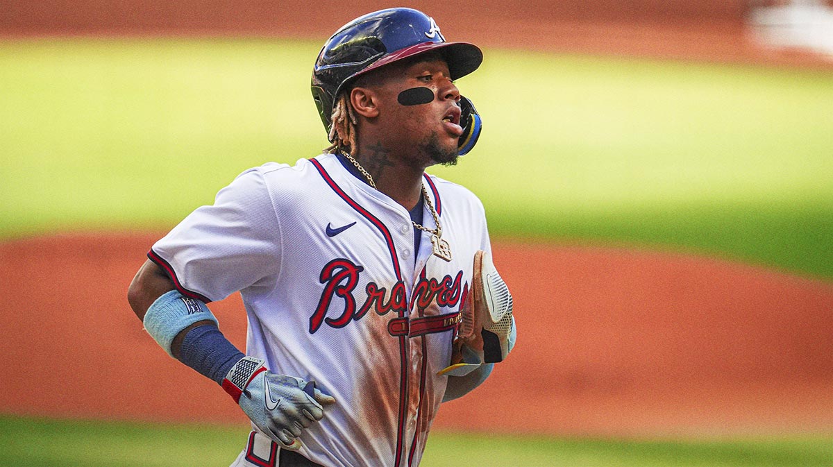 Atlanta Braves right fielder Ronald Acuna Jr (13) scores a run against the San Diego Padres during the first inning at Truist Park.