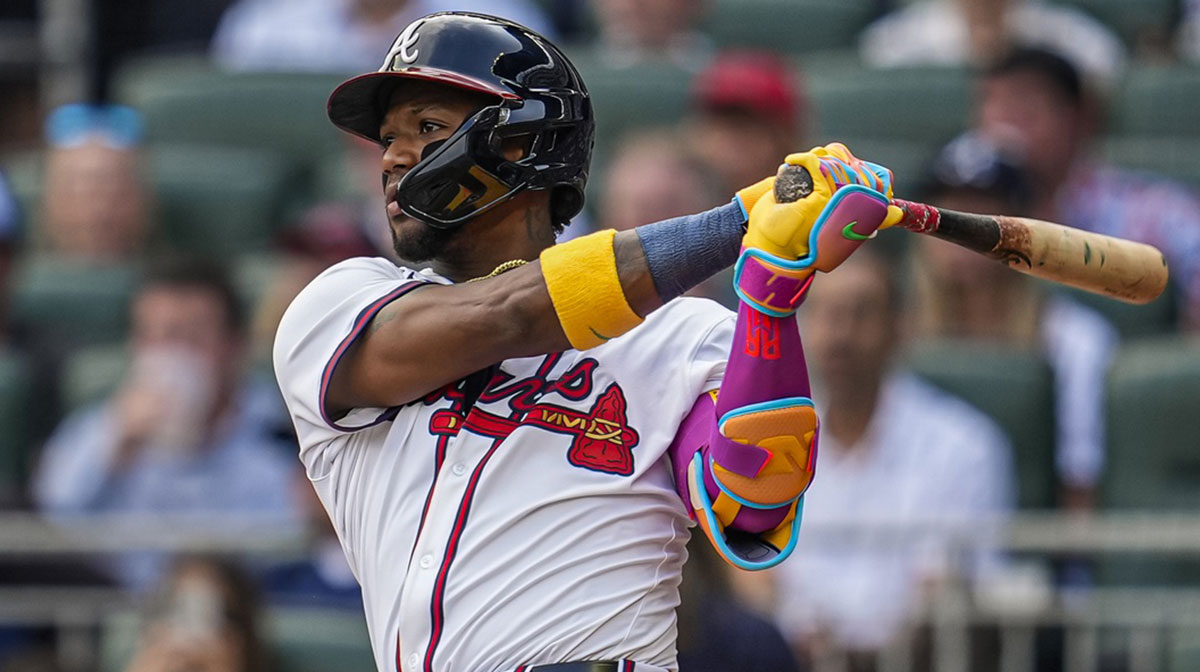 Atlanta Braves right fielder Ronald Acuna Jr (13) hits a double against the San Diego Padres during the fifth inning at Truist Park.