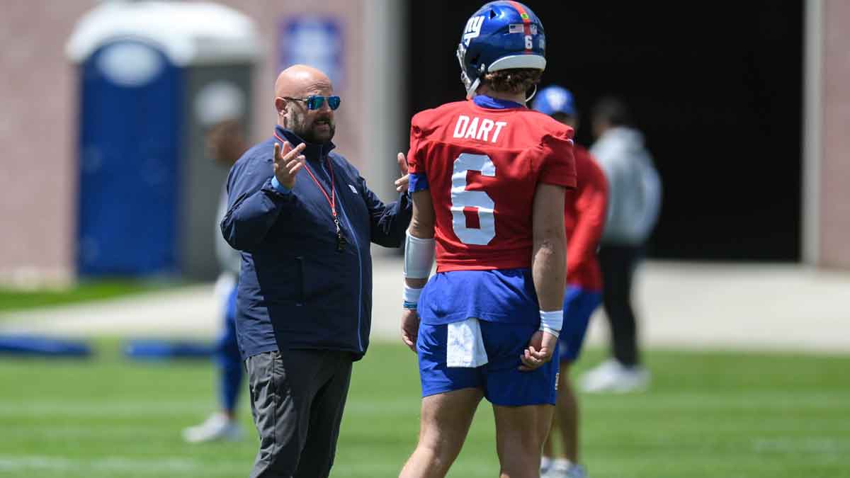 New York Giants head coach Brian Daboll talks to quarterback Jaxson Dart (6) during rookie minicamp at Quest Diagnostics Training Center.