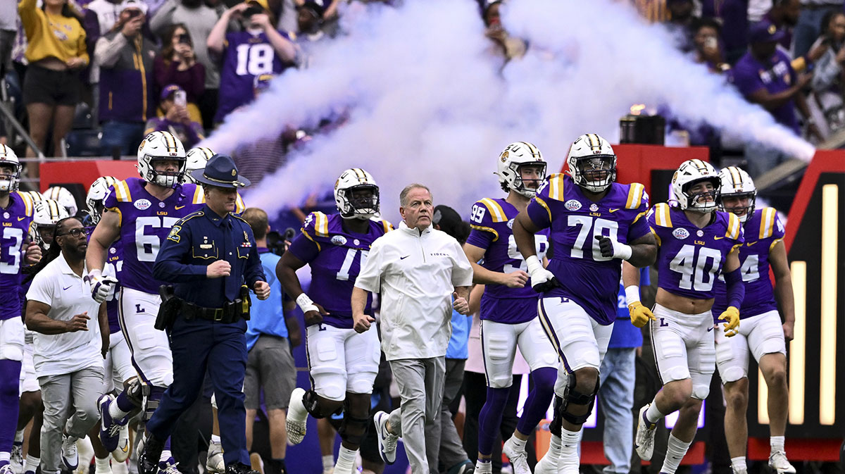 LSU Tigers head coach Brian Kelly enters the field with the team prior to the game against the Baylor Bears at NRG Stadium.