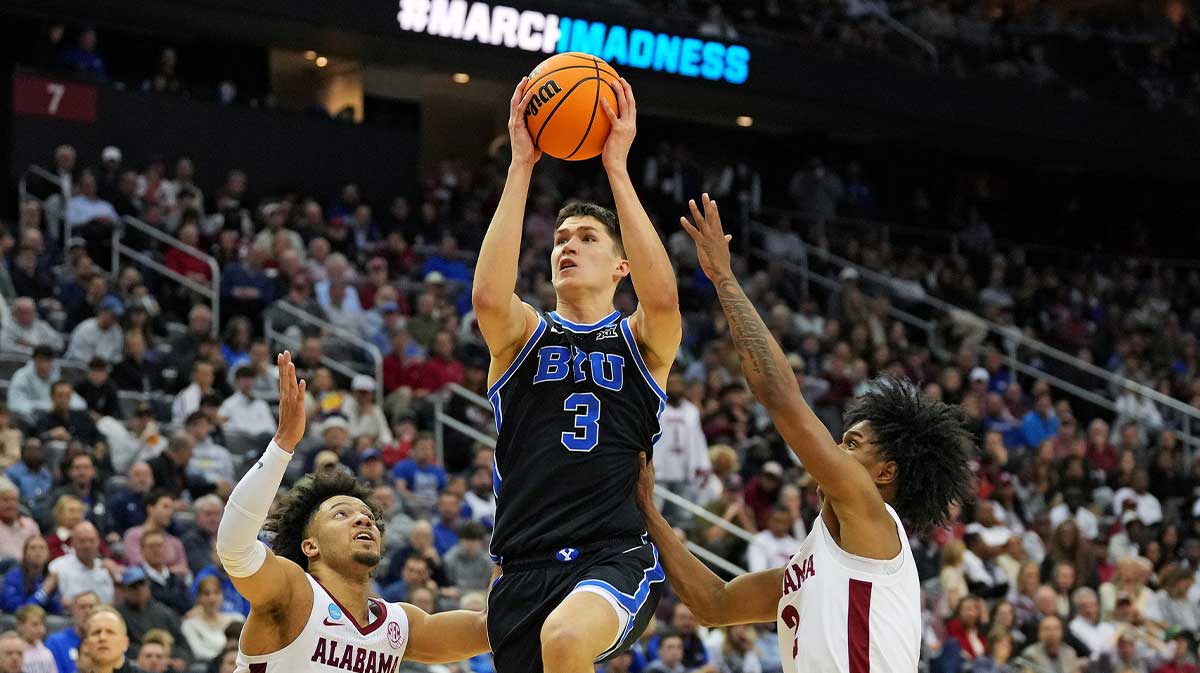 Brigham Young Cougars guard Egor Demin (3) drives to the basket against Alabama Crimson Tide guard Mark Sears (1) during the second half during an East Regional semifinal of the 2025 NCAA tournament at Prudential Center.