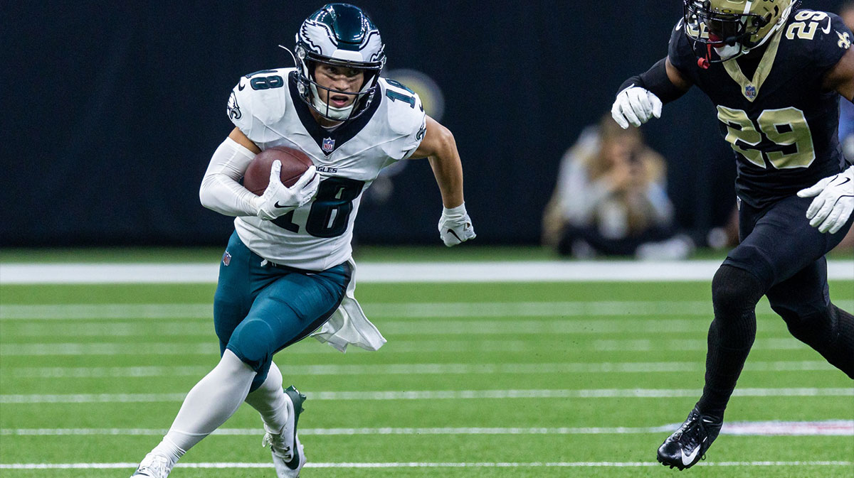 Philadelphia Eagles wide receiver Britain Covey (18) runs a pass back against New Orleans Saints cornerback Paulson Adebo (29) during the first half at Caesars Superdome.