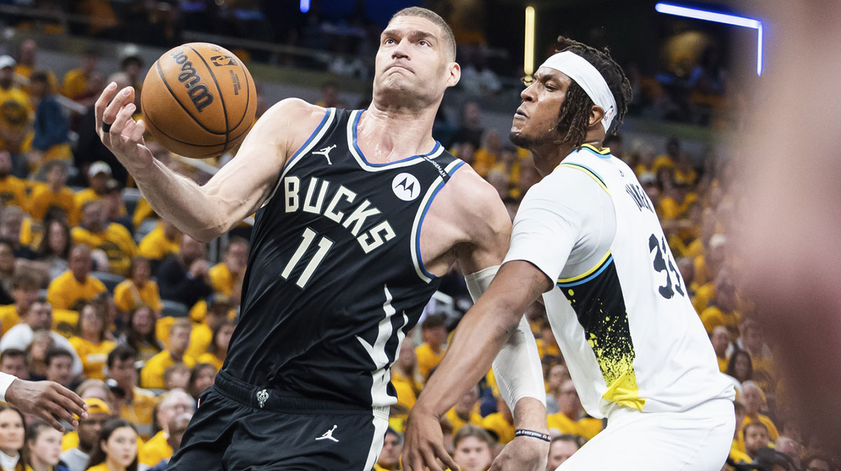 The center of Milwaukee Bucks Brook Lopez (11) pulls the ball while the center of the Pacers of Indiana Myles Turner (33) defends first half at Gainbridge Fieldhouse.
