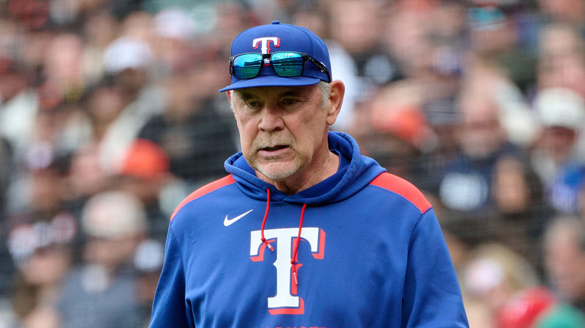Texas Rangers manager Bruce Bochy (15) walks onto the field to check on an injured player against the San Francisco Giants during the eighth inning at Oracle Park.