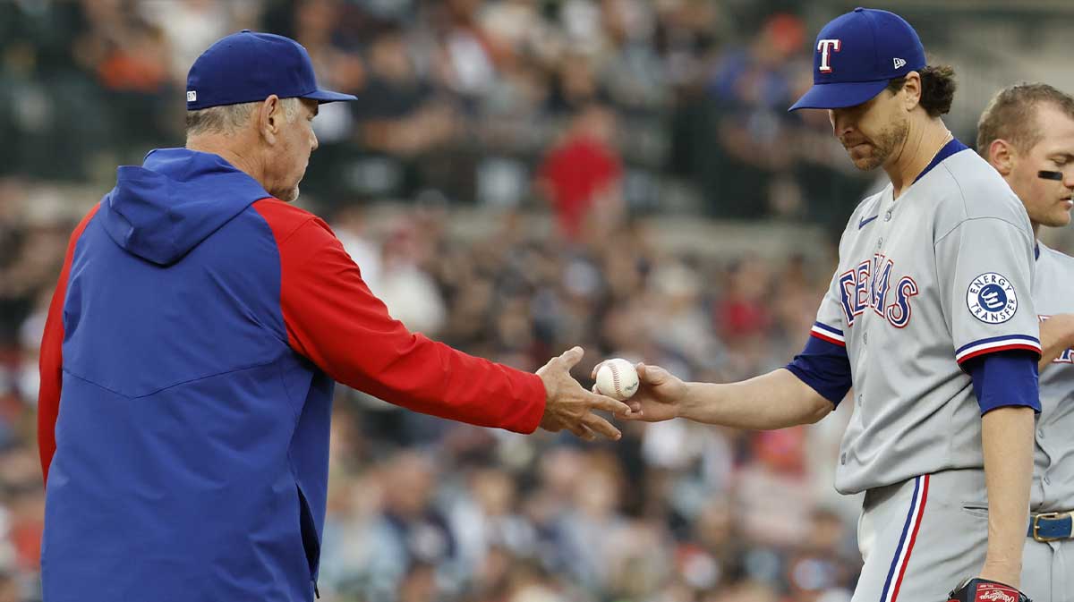 Texas Rangers manager Bruce Bochy (15) take the ball to relieve starting pitcher Jacob deGrom (48) in the sixth inning against the Detroit Tigers at Comerica Park.