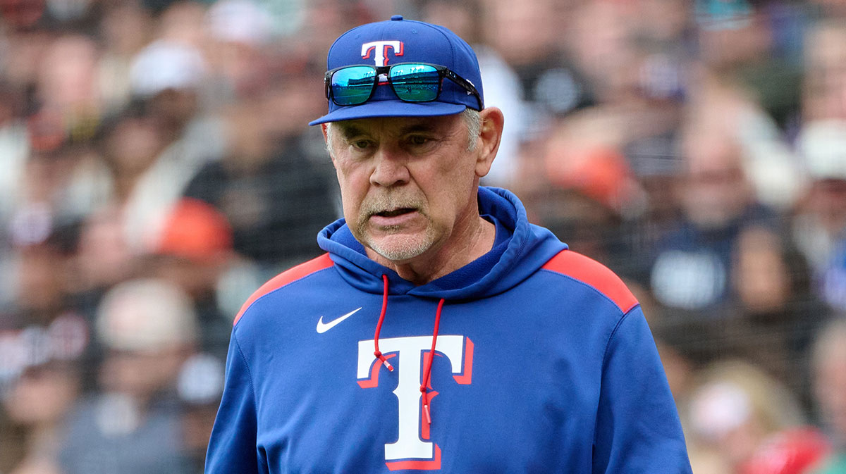 Texas Rangers manager Bruce Bochy (15) walks onto the field to check on an injured player against the San Francisco Giants during the eighth inning at Oracle Park.