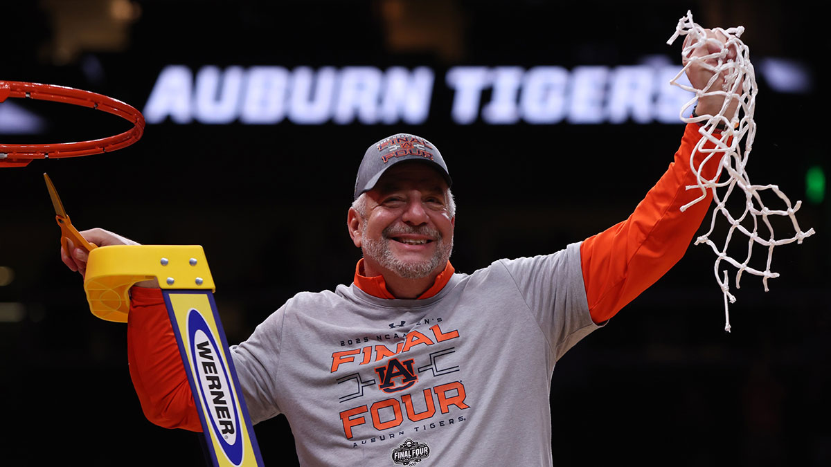 Auburn Tigers head coach Bruce Pearl cuts down the net after winning the South Regional final of the 2025 NCAA tournament against the Michigan State Spartans at State Farm Arena.