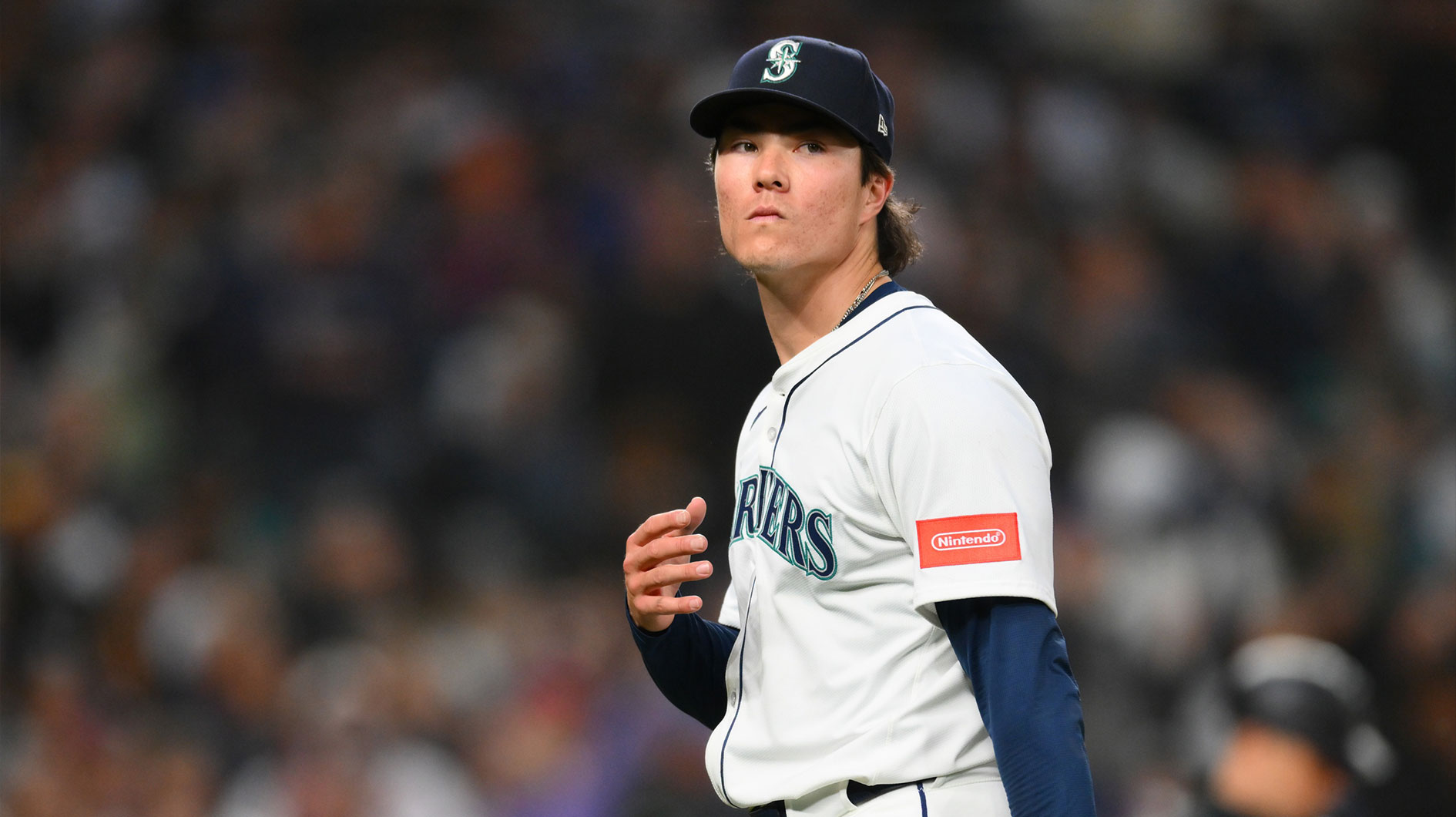 Seattle Mariners starting pitcher Bryan Woo (22) walks off the field after being pulled during the seventh inning against the New York Yankees at T-Mobile Park.
