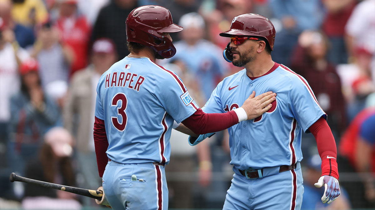 Philadelphia Phillies designated hitter Kyle Schwarber (12) celebrates his home run with first base Bryce Harper (3) during the seventh inning against the Colorado Rockies at Citizens Bank Park.
