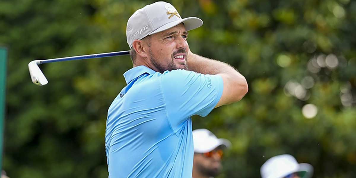 Bryson DeChambeau hits his tee shot on the sixth hole during a practice round for the PGA Championship golf tournament at Quail Hollow