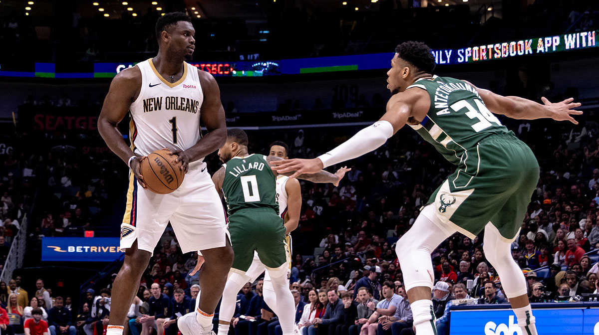 New Orleans Pelicans forward Zion Williamson (1) looks to pass the ball against Milwaukee Bucks forward Giannis Antetokounmpo (34) during the second half at Smoothie King Center.