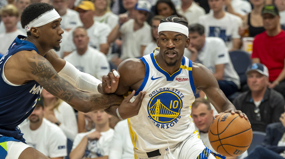 Golden State Warriors forward Jimmy Butler III (10) drives to the basket past Minnesota Timberwolves forward Jaden McDaniels (3) in the second half during game five of the second round for the 2025 NBA Playoffs at Target Center.