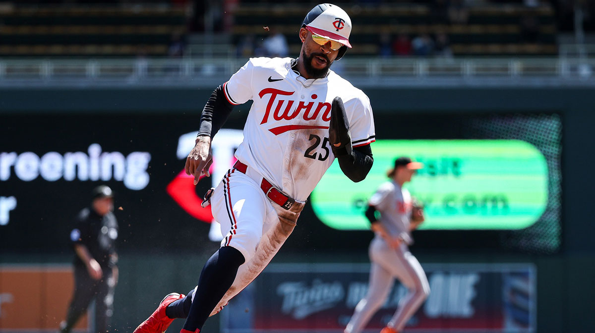 Minnesota Twins center fielder Byron Buxton (25) rounds third base to score on a single hit by first baseman Ty France (13) during the first inning against the Baltimore Orioles at Target Field.