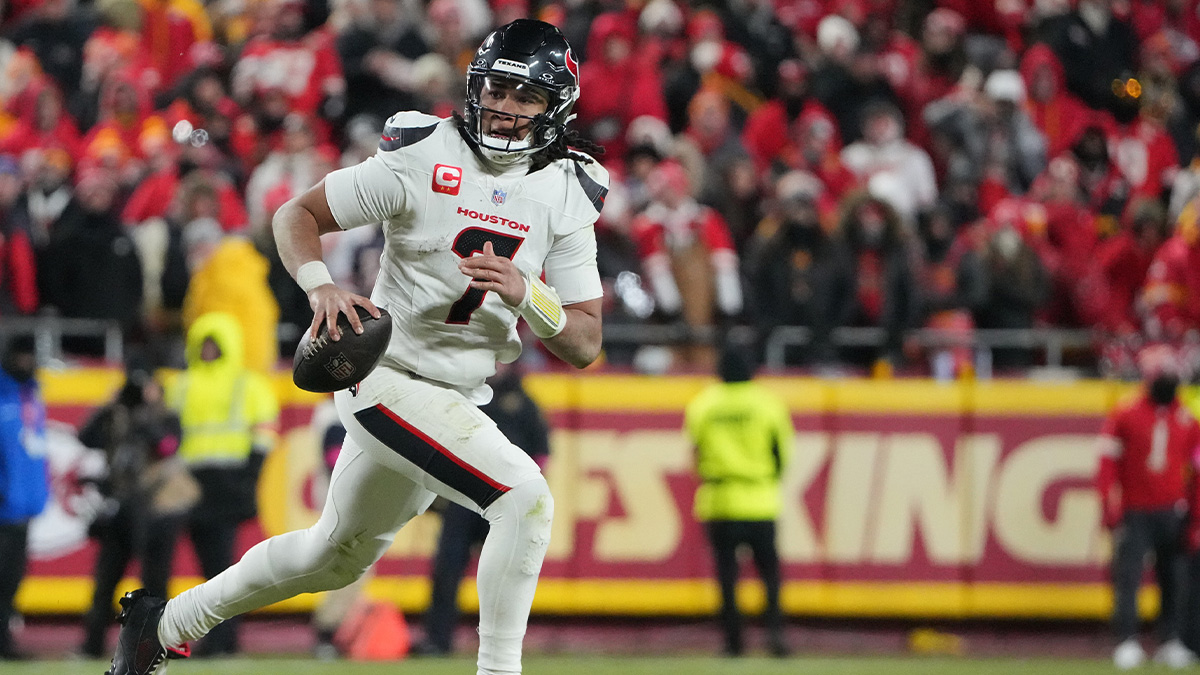 Houston Texans quarterback C.J. Stroud (7) rolls out to throw against the Kansas City Chiefs during the fourth quarter of a 2025 AFC divisional round game at GEHA Field at Arrowhead Stadium.