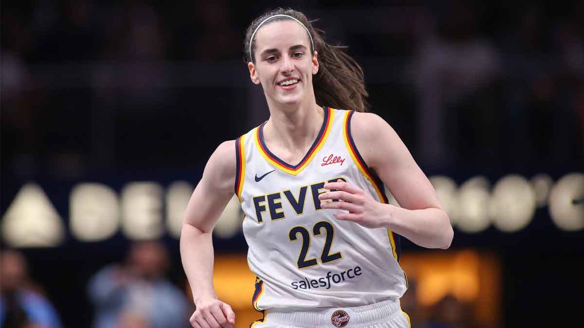 Indiana Fever guard Caitlin Clark (22) reacts after a basket against the Atlanta Dream in the first half at State Farm Arena.