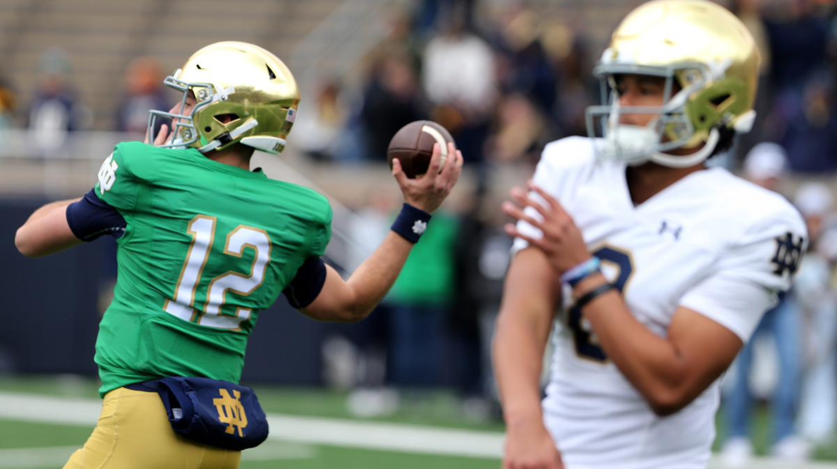 Notre Dame quarterbacks CJ Carr (12) and Kenny Minchey (8) warm up Saturday, April 20, 2024, at the annual Notre Dame Blue-Gold spring football game