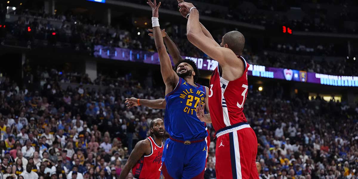 Denver Nuggets guard Jamal Murray (27) shoots over LA Clippers forward Nicolas Batum (33) in the second quarter during game seven of first round for the 2025 NBA Playoffs at Ball Arena. Mandatory Credit: Ron Chenoy-Imagn Images
