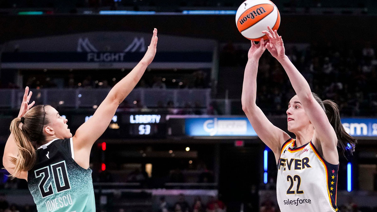 Indiana Fever guard Caitlin Clark (22) attempts a 3-pointer against New York Liberty guard Sabrina Ionescu (20) on Saturday, May 24, 2025, during a game between the Indiana Fever and the New York Liberty at Gainbridge Fieldhouse in Indianapolis.