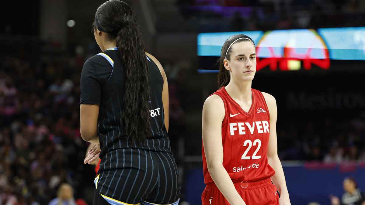 Indiana Fever guard Caitlin Clark (22) walks by Chicago Sky forward Angel Reese (5) during the second half at Wintrust Arena.
