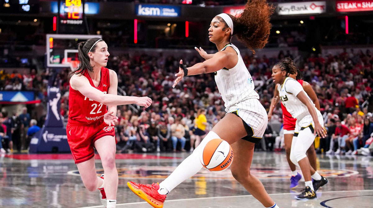 Indiana Fever guard Caitlin Clark (22) passes around Chicago Sky forward Angel Reese (5) on Saturday, May 17, 2025, during a game between the Indiana Fever and the Chicago Sky at Gainbridge Fieldhouse in Indianapolis. The Indiana Fever defeated the Chicago Sky, 93-58.