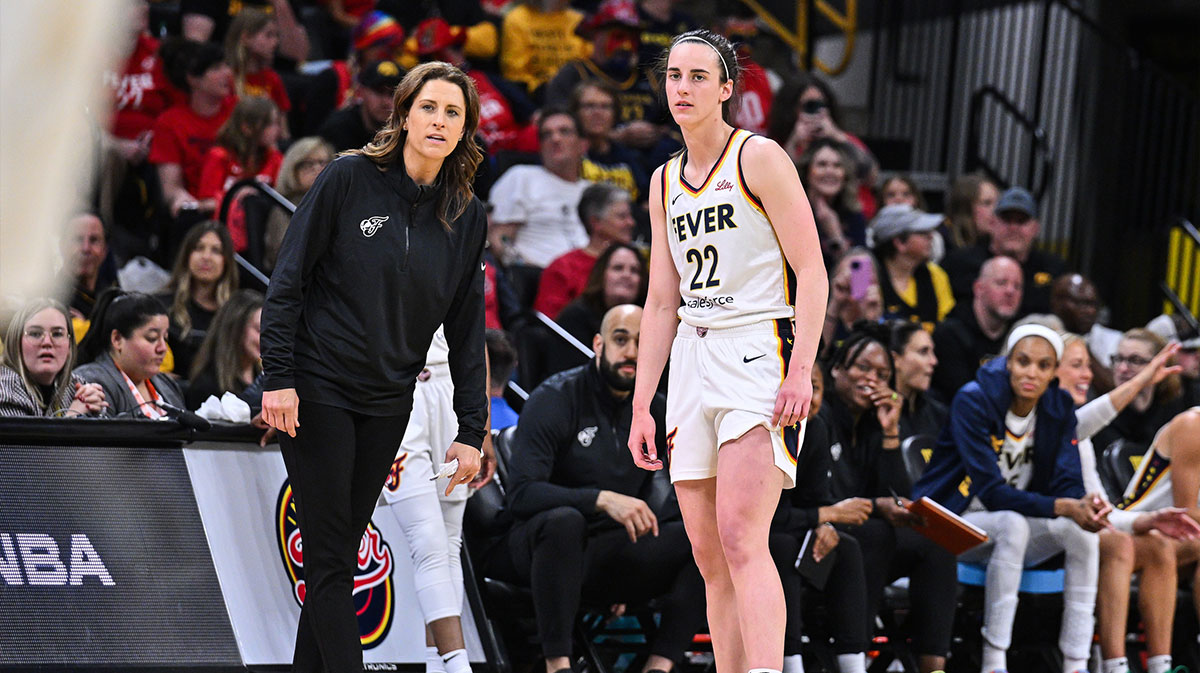 Indiana Fever guard Caitlin Clark (22) looks on with head coach Stephanie White during the third quarter against the Brazil National Team at Carver-Haweye Arena.
