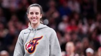 Indiana Fever Caitlin Clark (22) smiles Saturday, May 3, 2025, during a timeout at a preseason game between the Indiana Fever and the Washington Mystics at Gainbridge Fieldhouse in Indianapolis.