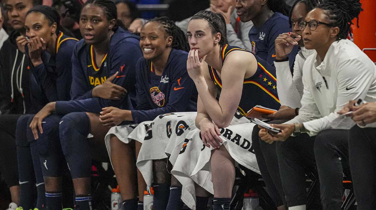 Indiana Fever guard Caitlin Clark (22) watches the game against the Atlanta Dream from the bench during the second half at Gateway Center Arena @ College Park.