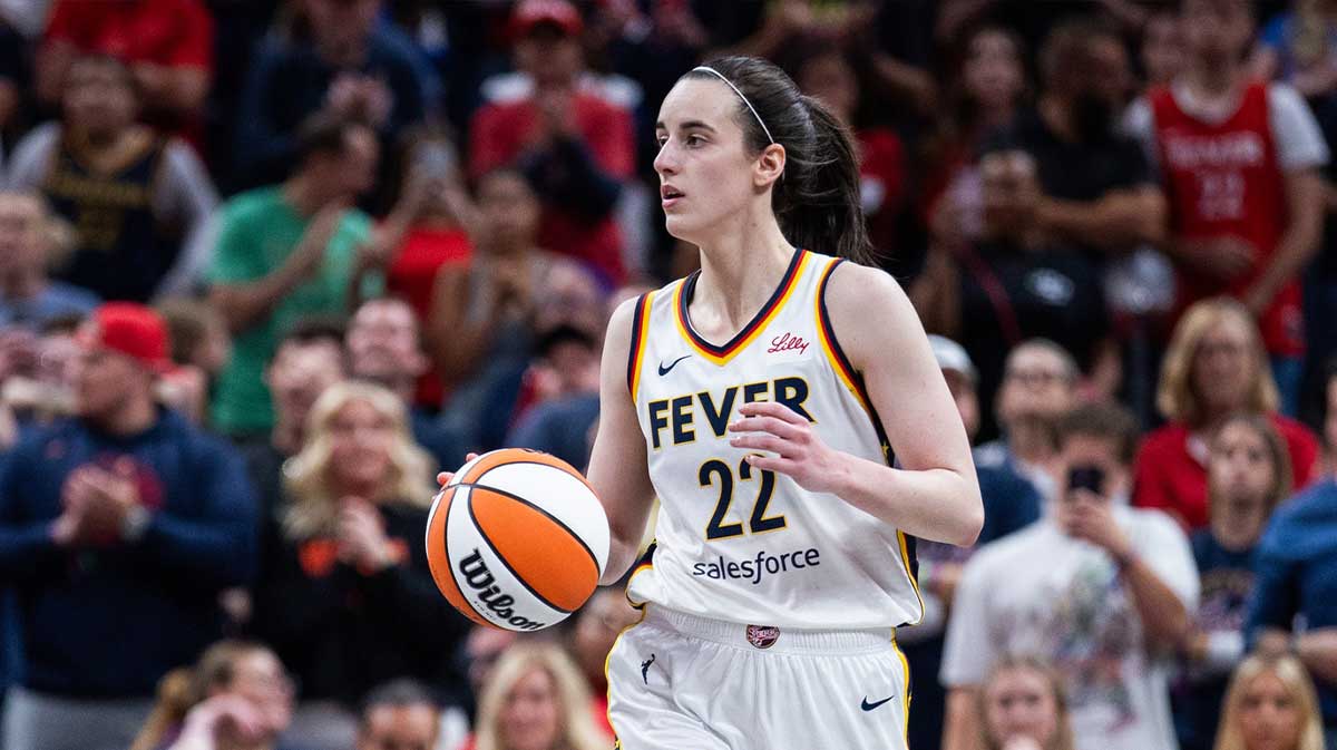 Indiana Fever guard Caitlin Clark (22) dribbles the ball in the second half against the New York Liberty at Gainbridge Fieldhouse.
