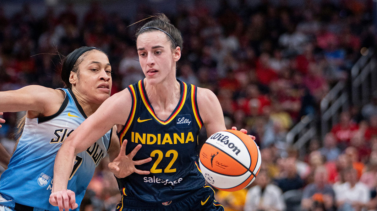 Indiana Fever guard Caitlin Clark (22) dribbles around Chicago Sky guard Chennedy Carter (7) on Sunday June 16, 2024, during the game at Gainbridge Fieldhouse in Indianapolis. The Fever beat the Sky 91-83.