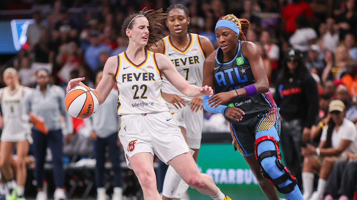 Indiana Fever guard Caitlin Clark (22) is fouled by Atlanta Dream guard Rhyne Howard (10) in the fourth quarter at State Farm Arena.