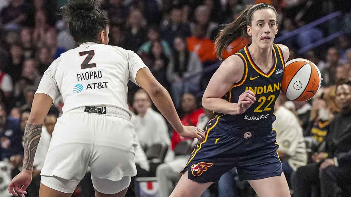 Indiana Fever guard Caitlin Clark (22) dribbles against Atlanta Dream guard Te-Hina Paopao (2) during the second half at Gateway Center Arena @ College Park.