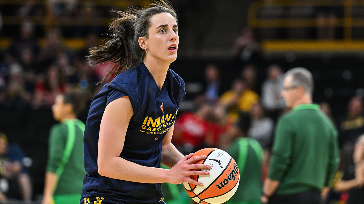 Indiana Fever guard Caitlin Clark (22) warms up before the game against the Brazil National Team at Carver-Haweye Arena.