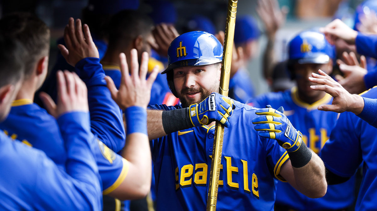 May 30, 2025; Seattle, Washington, USA; Seattle Mariners catcher Cal Raleigh (29, right) celebrates in the dugout after hitting three-run home run against the Minnesota Twins during the first inning at T-Mobile Park.