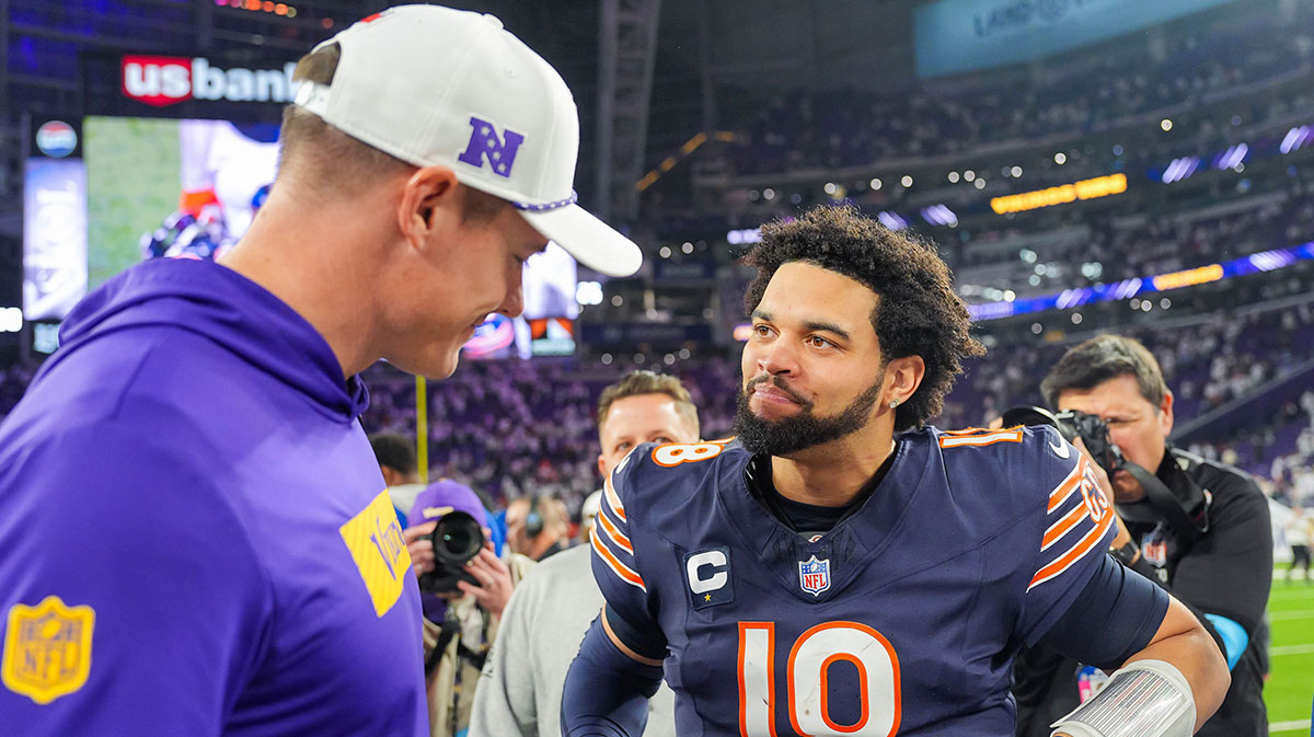 Chicago Bears quarterback Caleb Williams (18) talks to Minnesota Vikings head coach Kevin O'Connell after the game quarter at U.S. Bank Stadium.