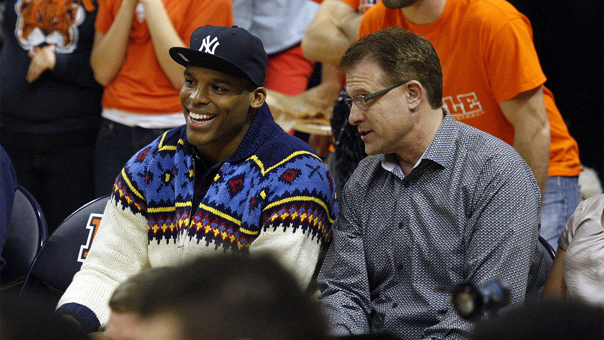 Carolina Panthers quarterback Cam Newton and Auburn Tigers head football coach Gus Malzahn talk during the game against the Alabama Crimson Tide.