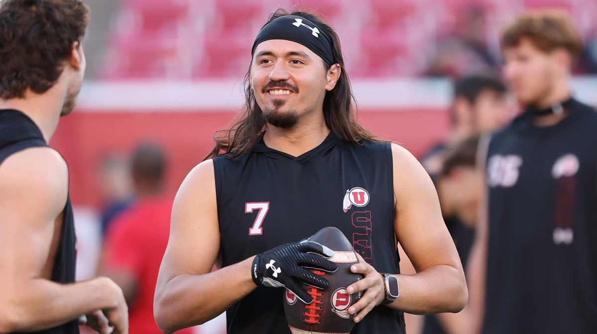 Utah Utes quarterback Cameron Rising (7) warms up before a game against the Arizona Wildcats at Rice-Eccles Stadium.