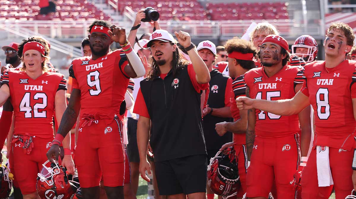 Utah Utes quarterback Cameron Rising joins the team to sing the “Utah Man” fight song after the game against the Baylor Bears at Rice-Eccles Stadium.