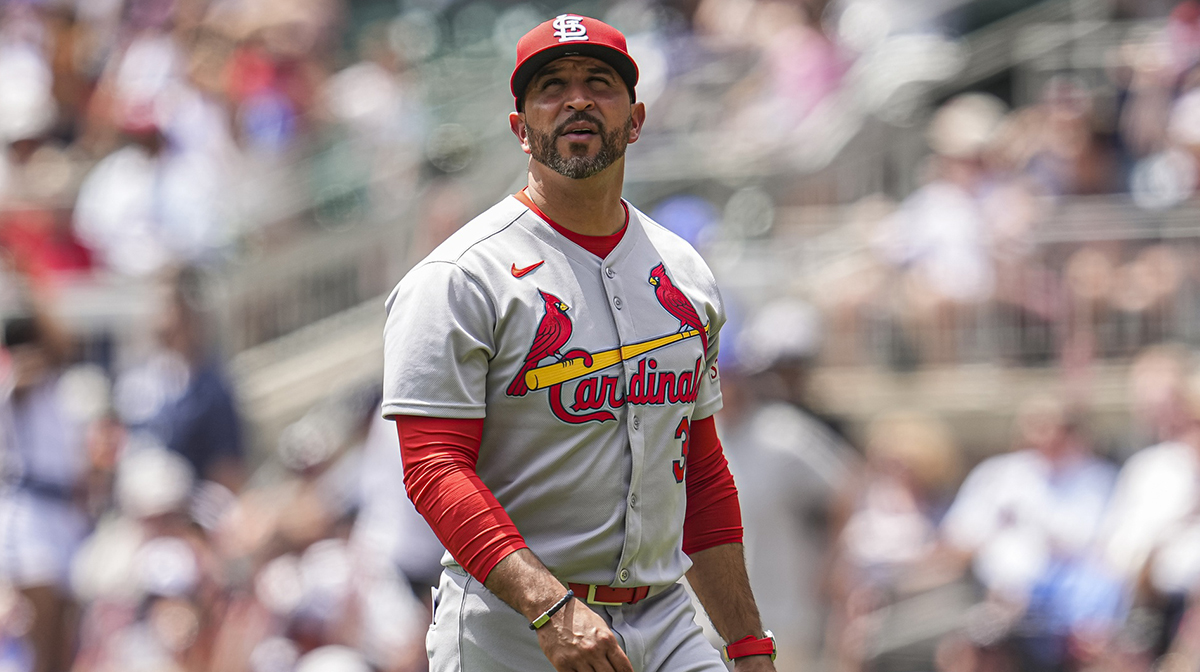 St. Louis Cardinals manager Oliver Marmol (37) on the field to change pitchers against the Atlanta Braves during the seventh inning at Truist Park.