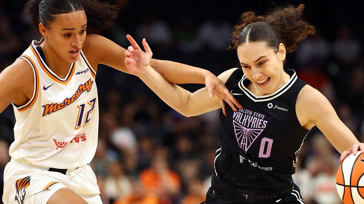 Golden State Valkyries guard Carla Leite (0) controls the ball against Phoenix Mercury guard Celeste Taylor (12) during a preseason game at PHX Arena.