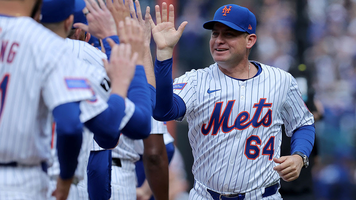 New York Mets manager Carlos Mendoza (64) is introduced before the Mets home opener against the Toronto Blue Jays.