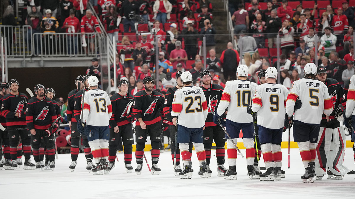 Carolina Hurricanes and Florida Panthers line up to shake hands after the third period in game five of the Eastern Conference Final of the 2025 Stanley Cup Playoffs at Lenovo Center.