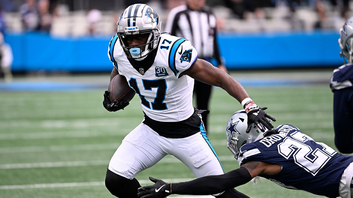 Carolina Panthers wide receiver Xavier Legette (17) with the ball as Dallas Cowboys cornerback Amani Oruwariye (27) defefends in the first quarter at Bank of America Stadium.
