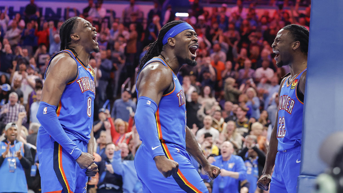 Oklahoma City Thunder forward Jalen Williams (8), guard Luguentz Dort (5) celebrate with Oklahoma City Thunder guard Cason Wallace (22) after he made a basket against the Los Angeles Lakers during the second half at Paycom Center.