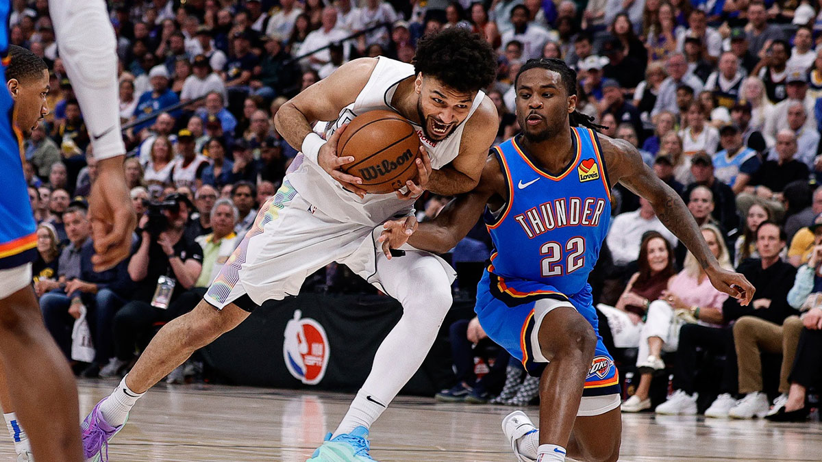 Denver Nuggets guard Jamal Murray (27) drives to the net against Oklahoma City Thunder guard Cason Wallace (22) in the fourth quarter during game six of the second round for the 2025 NBA Playoffs at Ball Arena.