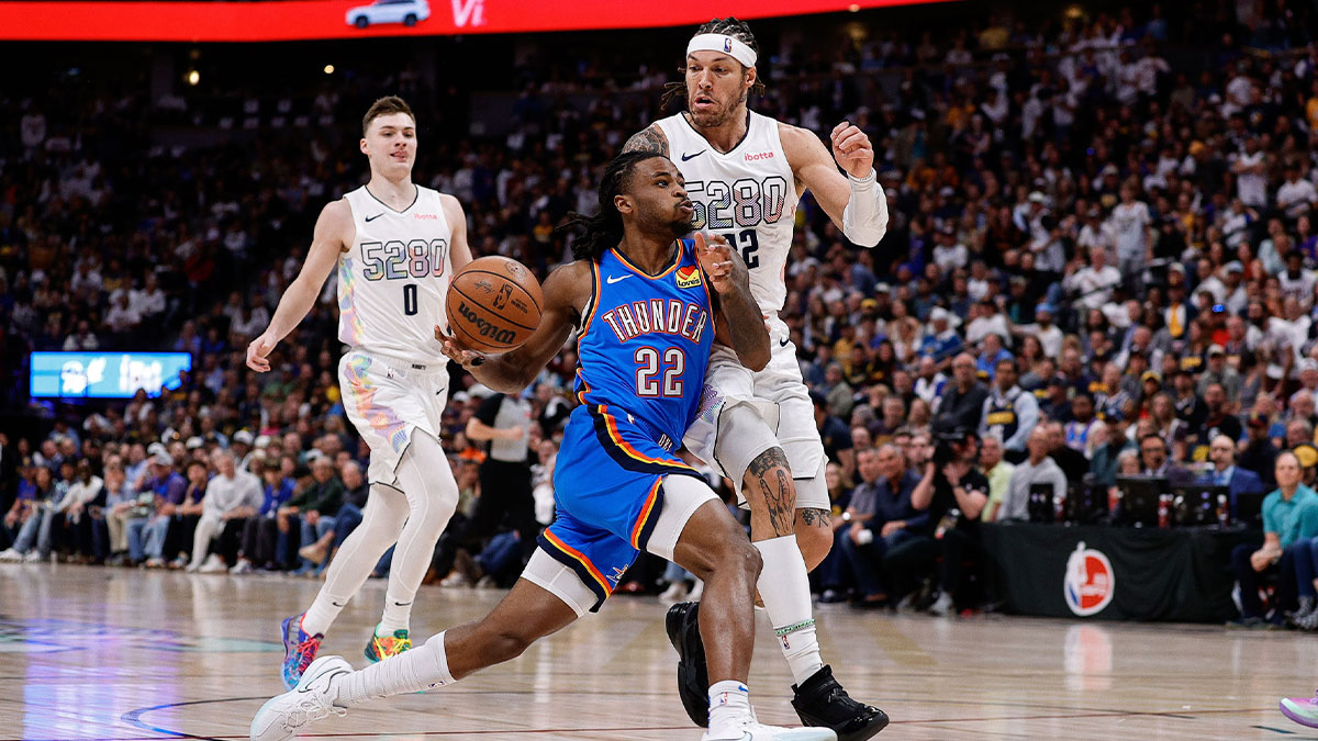 Oklahoma City Thunder guard Cason Wallace (22) drives to the net against Denver Nuggets forward Aaron Gordon (32) in the first quarter during game six of the second round for the 2025 NBA Playoffs at Ball Arena. 